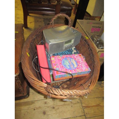 528 - WICKER BASKET OF CHILDRENS  BOOKS  RADIOS ETC