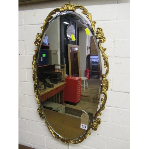 579 - DECORATIVE OVAL MIRROR