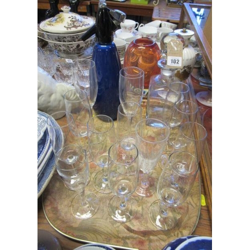 102 - CHAMPAGNE FLUTES  DECANTERS AND A SODA SYPHON