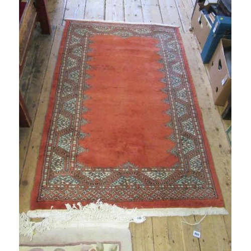 880 - RED PATTERNED FRINGED RUG