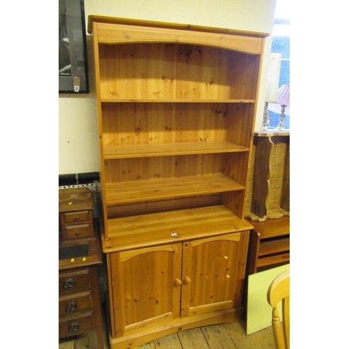 951 - PINE BOOKCASE ON CUPBOARD