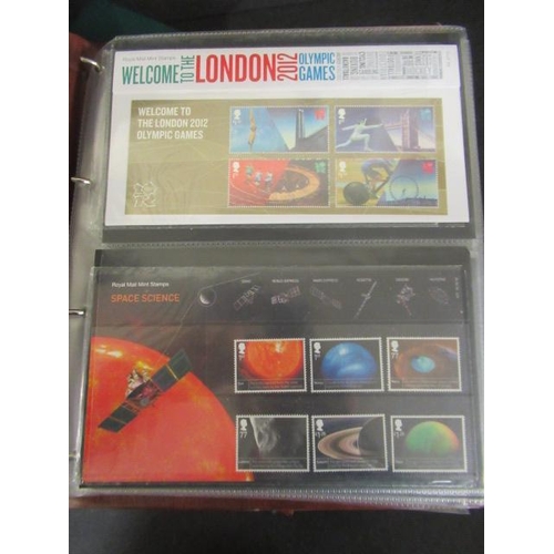 THREE ALBUMS OF ROYAL MAIL PRESENTATION PACK STAMPS