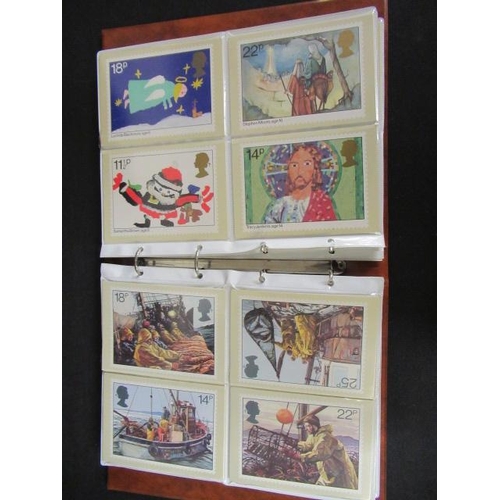 604 - THREE ALBUMS OF STAMP POSTCARDS