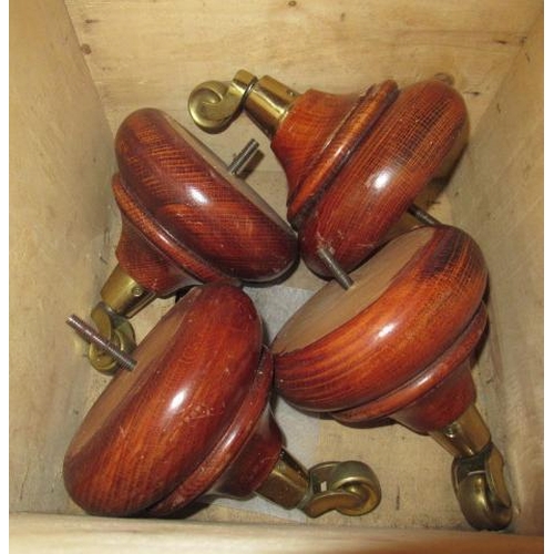 555 - BOX OF WOODEN AND BRASS CASTORS