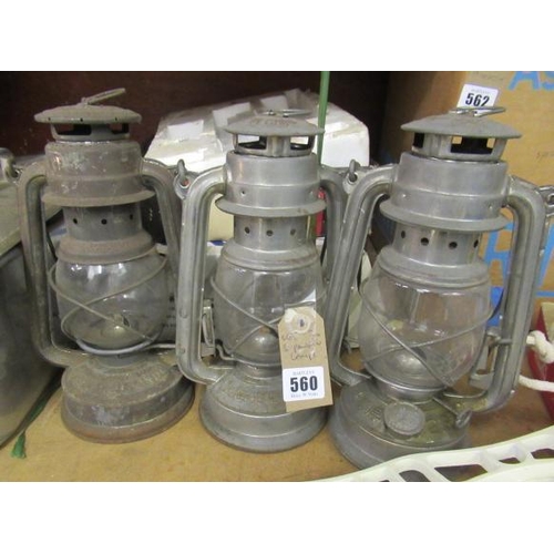 560 - THREE PARAFFIN LAMPS