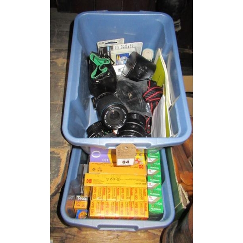 84 - BOX OF CAMERA LENSES AND TWO BOXES OF FILM