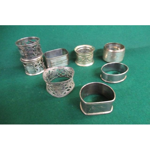 329 - SIX SILVER NAPKIN RINGS AND TWO OTHERS