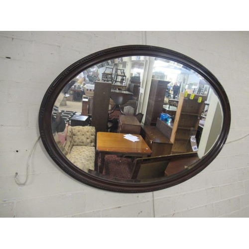 740 - MAHOGANY OVAL FRAMED MIRROR