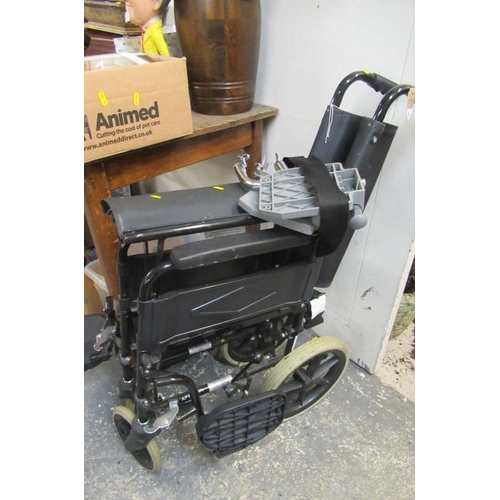 711 - FOLDING WHEELCHAIR