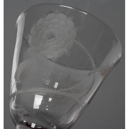 109 - A JACOBITE WINE GLASS, mid 18th century, the round funnel bowl engraved with a rose, bud and a star,... 