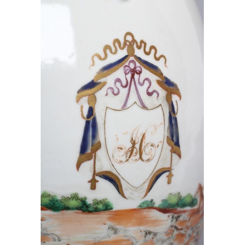 12 - A CHINESE ARMORIAL PORCELAIN LARGE BARREL JUG, the entwined reeded handle with leaf terminals, centr... 