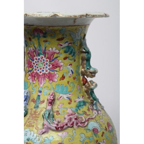 13 - A CHINESE PORCELAIN VASE of baluster form with everted shaped rim and two shi-shi handles, painted i... 