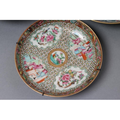 16 - A CHINESE PORCELAIN FAMILLE ROSE SAUCER painted with three figures in a garden within a blue and gil... 