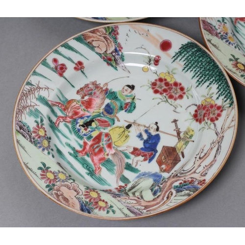 17 - A SET OF THREE CHINESE PORCELAIN FAMILLE ROSE PLATES painted with a horseman fording a stream, his s... 