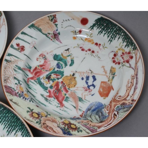 17 - A SET OF THREE CHINESE PORCELAIN FAMILLE ROSE PLATES painted with a horseman fording a stream, his s... 