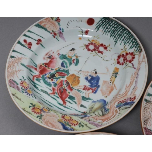 17 - A SET OF THREE CHINESE PORCELAIN FAMILLE ROSE PLATES painted with a horseman fording a stream, his s... 