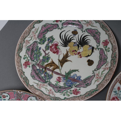 18 - A CHINESE PORCELAIN FAMILLE ROSE PLATE centrally painted with a pair of yellow and black cockerels w... 