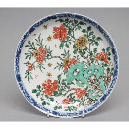 21 - A CHINESE PORCELAIN SAUCER DISH of plain circular form, painted in colours with rockwork and floweri... 