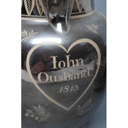 27 - A DOCUMENTARY DRABWARE JUG, 1813, of baluster form, painted in silver lustre with a heart panel insc... 