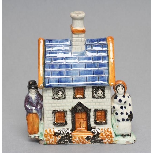 29 - A MEXBOROUGH TYPE PRATTWARE PEARLWARE MONEY BOX, early 19th century, the two storey house flanked by... 