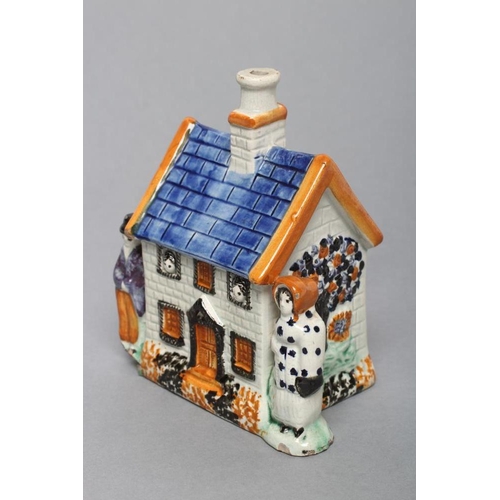 29 - A MEXBOROUGH TYPE PRATTWARE PEARLWARE MONEY BOX, early 19th century, the two storey house flanked by... 