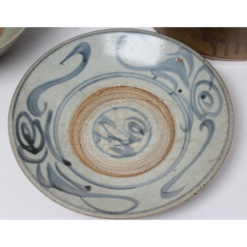 4 - A CHINESE PROVINCIAL STONEWARE BOWL of plain circular form, the exterior painted in underglaze blue ... 