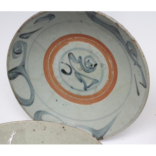 4 - A CHINESE PROVINCIAL STONEWARE BOWL of plain circular form, the exterior painted in underglaze blue ... 