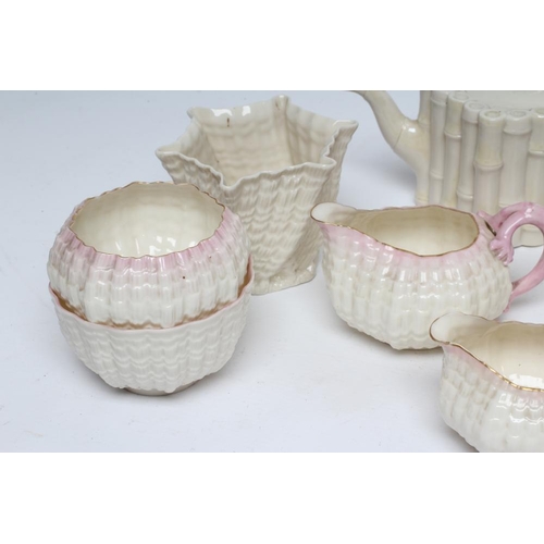 42 - A VICTORIAN FIRST PERIOD BELLEEK PORCELAIN NAUTILUS TEA SERVICE with shaded pink rims, comprising si... 