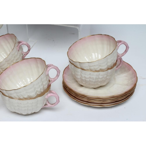 42 - A VICTORIAN FIRST PERIOD BELLEEK PORCELAIN NAUTILUS TEA SERVICE with shaded pink rims, comprising si... 