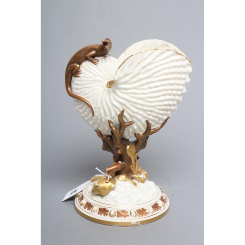 47 - A LATE VICTORIAN ROYAL WORCESTER NAUTILUS VASE surmounted by a lizard, raised upon a bronzed and gil... 