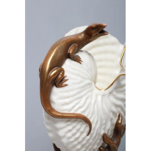 47 - A LATE VICTORIAN ROYAL WORCESTER NAUTILUS VASE surmounted by a lizard, raised upon a bronzed and gil... 