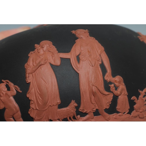 49 - A WEDGWOOD ROSSO ANTICO TEAPOT AND COVER, 1988, of squat globular form, with classical figure sprigg... 