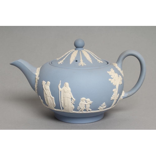 57 - A WEDGWOOD BLUE JASPER TEAPOT AND COVER, modern, with classical figure sprigging, together with a si... 