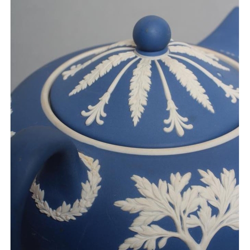 57 - A WEDGWOOD BLUE JASPER TEAPOT AND COVER, modern, with classical figure sprigging, together with a si... 