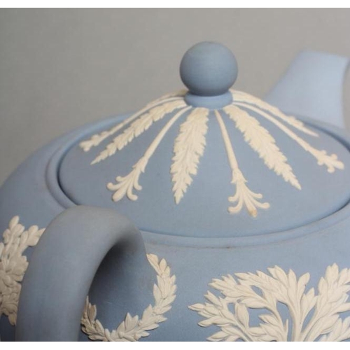 57 - A WEDGWOOD BLUE JASPER TEAPOT AND COVER, modern, with classical figure sprigging, together with a si... 