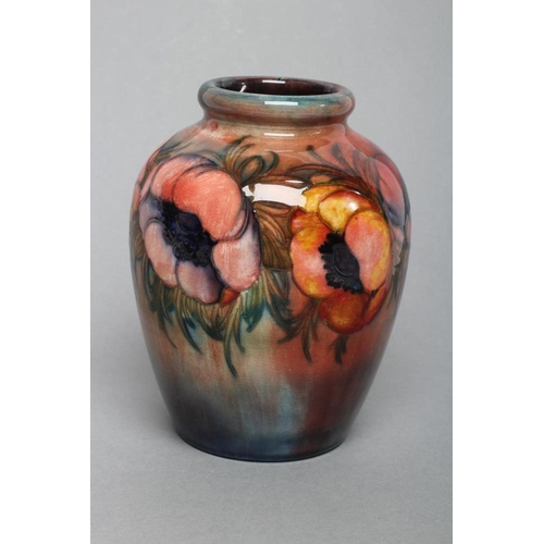 59 - A MOORCROFT ANEMONE PATTERN POTTERY VASE, mid 20th century, of rounded ovoid form, tubelined and pai... 