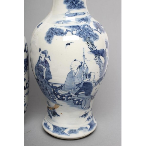 8 - TWO CHINESE PORCELAIN VASES, the larger of inverted baluster form painted in underglaze blue with tr... 