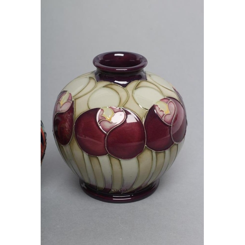 82 - THREE MOORCROFT POTTERY SMALL VASES, comprising a globular example with art nouveau style flowerhead... 