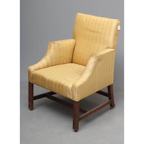 667 - A GEORGIAN MAHOGANY FRAMED ARMCHAIR, late 18th century, upholstered in a yellow striped weave, the p... 