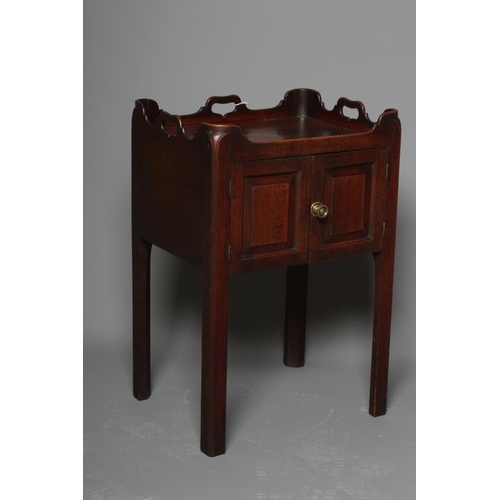 669 - A GEORGIAN MAHOGANY BEDSIDE CUPBOARD, third quarter 18th century, of shallow oblong form, the waved ... 