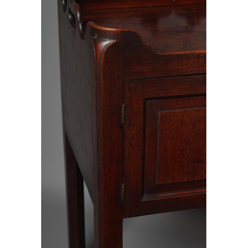 669 - A GEORGIAN MAHOGANY BEDSIDE CUPBOARD, third quarter 18th century, of shallow oblong form, the waved ... 