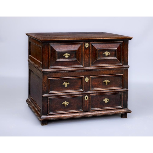 677 - AN OAK GEOMETRIC CHEST, c.1700, the moulded edged and banded top over one deep and two shallow twin ... 