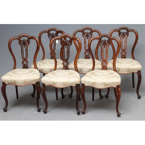 680 - A SET OF SIX VICTORIAN ROSEWOOD DINING CHAIRS of balloon back form upholstered in cream silk damask,... 