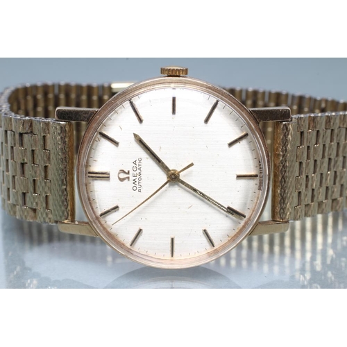 175 - A GENTLEMAN'S 9CT GOLD OMEGA AUTOMATIC WRISTWATCH, the silvered dial with applied gilt metal batons,... 