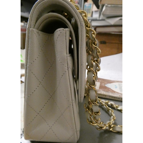 A CHANEL WHITE CAVIAR LEATHER QUILTED CLASSIC HANDBAG, with leather and  metal chain link handle an