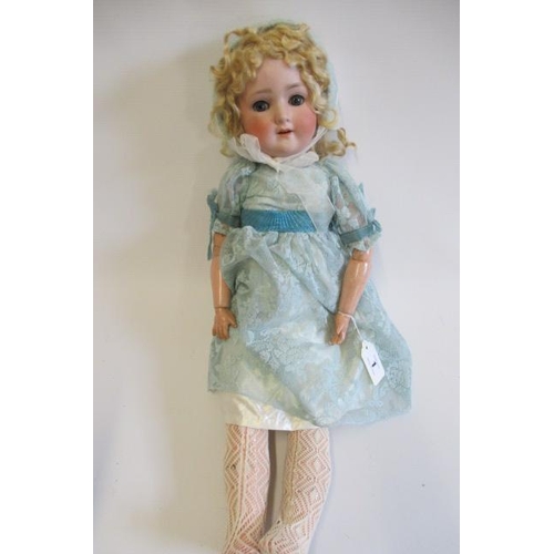 1 - A Schoenau & Hoffmeister bisque socket head doll, with blue glass sleeping eyes, open mouth, teeth, ... 