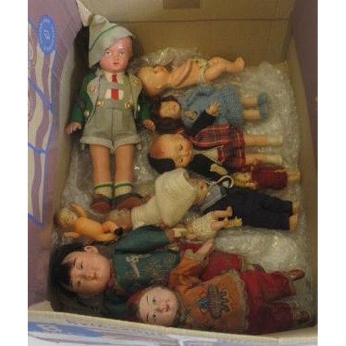 102 - Eleven vintage dolls, comprising two composition oriental dolls in traditional outfits, and nine cel... 