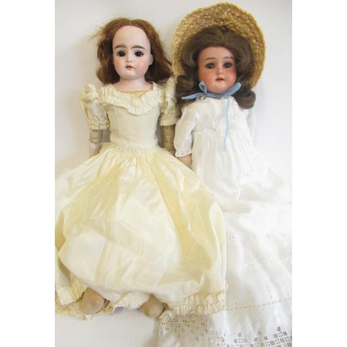 118 - Two Armand Marseille bisque shoulder head dolls, comprising an 18