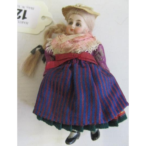 12 - A bisque socket head doll's house doll, with blue glass fixed eyes, blond wig, 5 piece bisque body, ... 