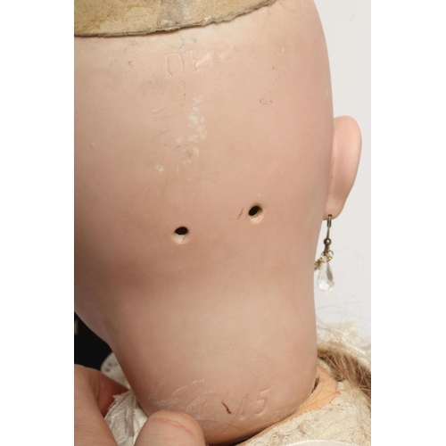 123 - A large DEP bisque socket head doll, with brown glass sleeping eyes, open mouth, moulded teeth, pier... 